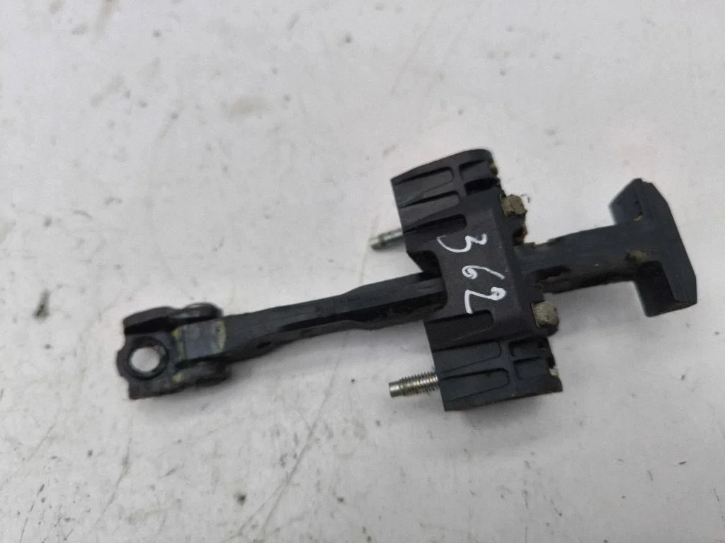 Rear door check strap stopper – left