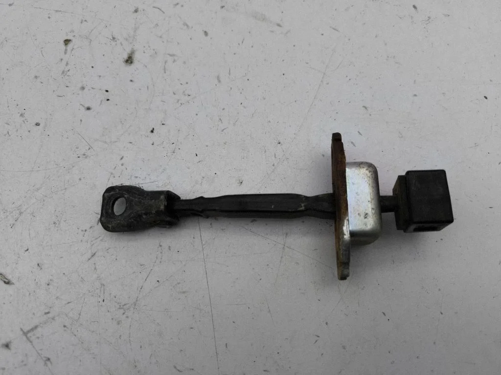 Rear door check strap stopper – right