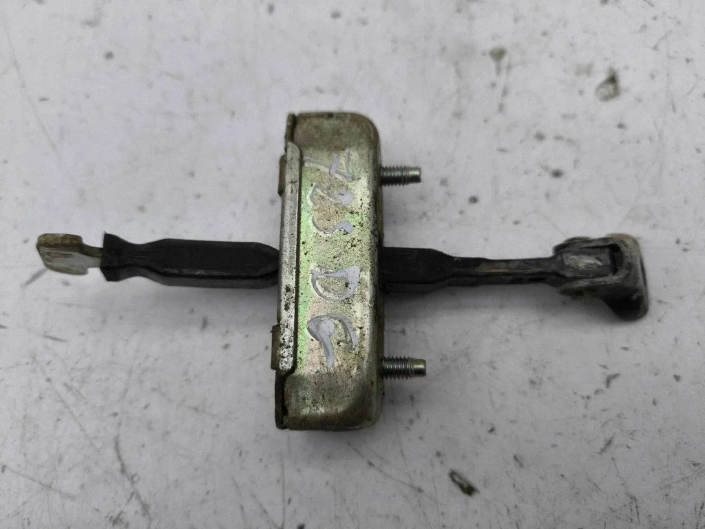 Rear door check strap stopper – right