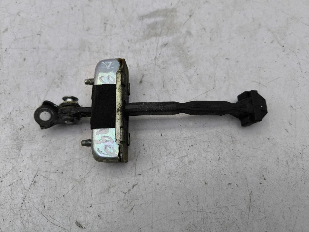 Rear door check strap stopper – left