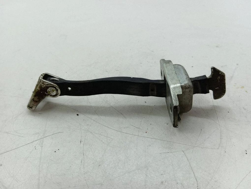 Rear door check strap stopper – right