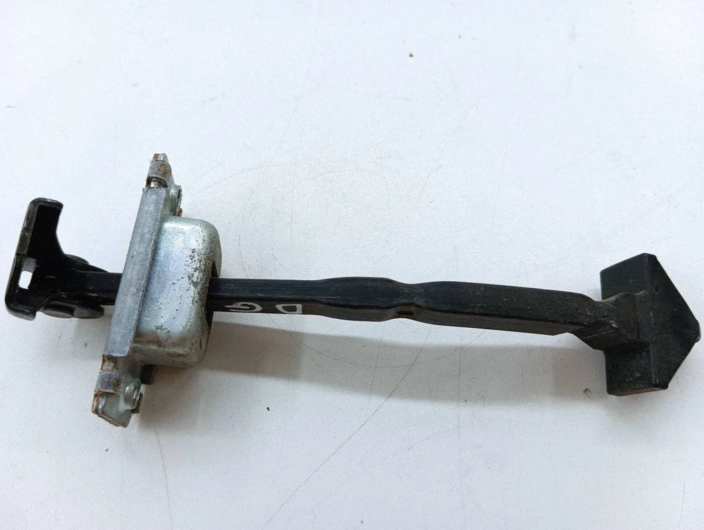 Rear door check strap stopper – right