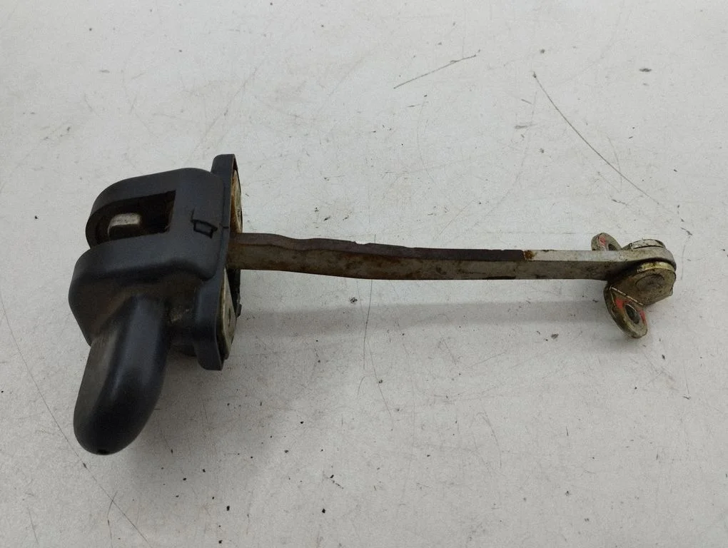 Rear door check strap stopper – right