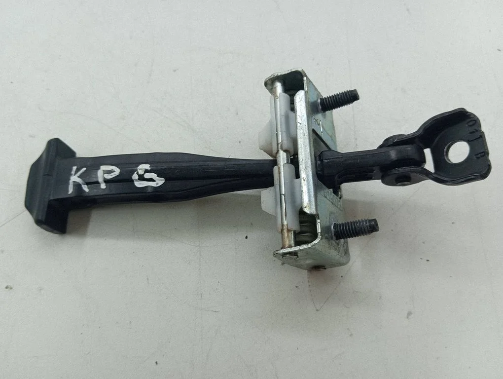 Rear door check strap stopper – left