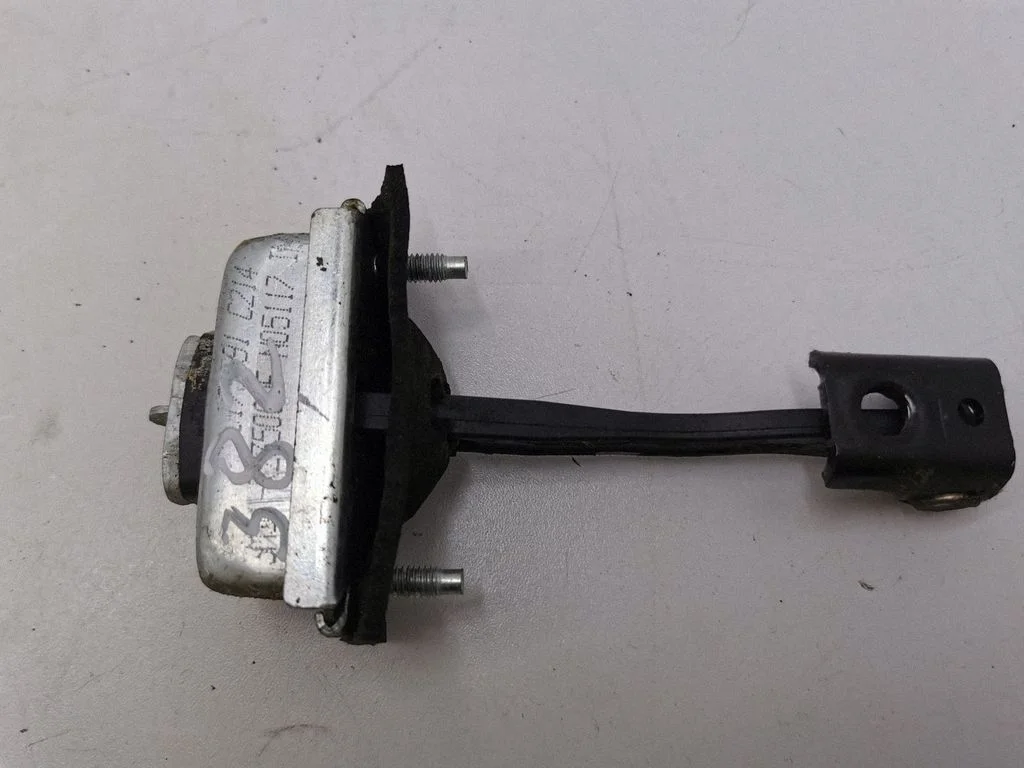 Rear door check strap stopper N05117