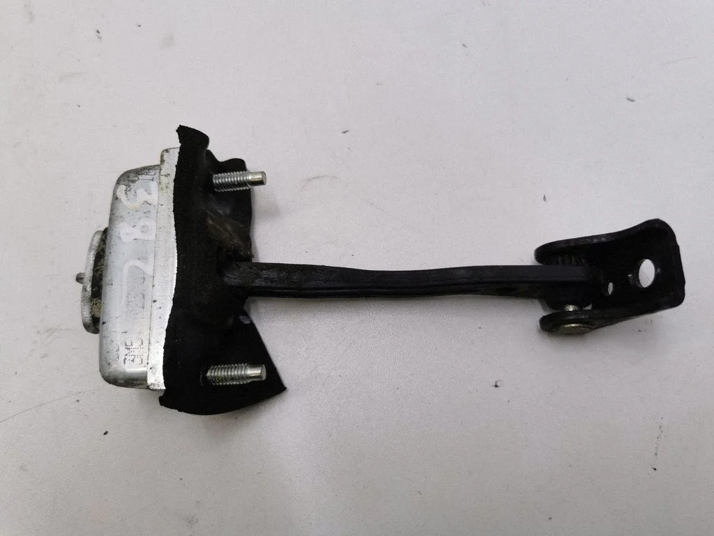 Rear door check strap stopper – left