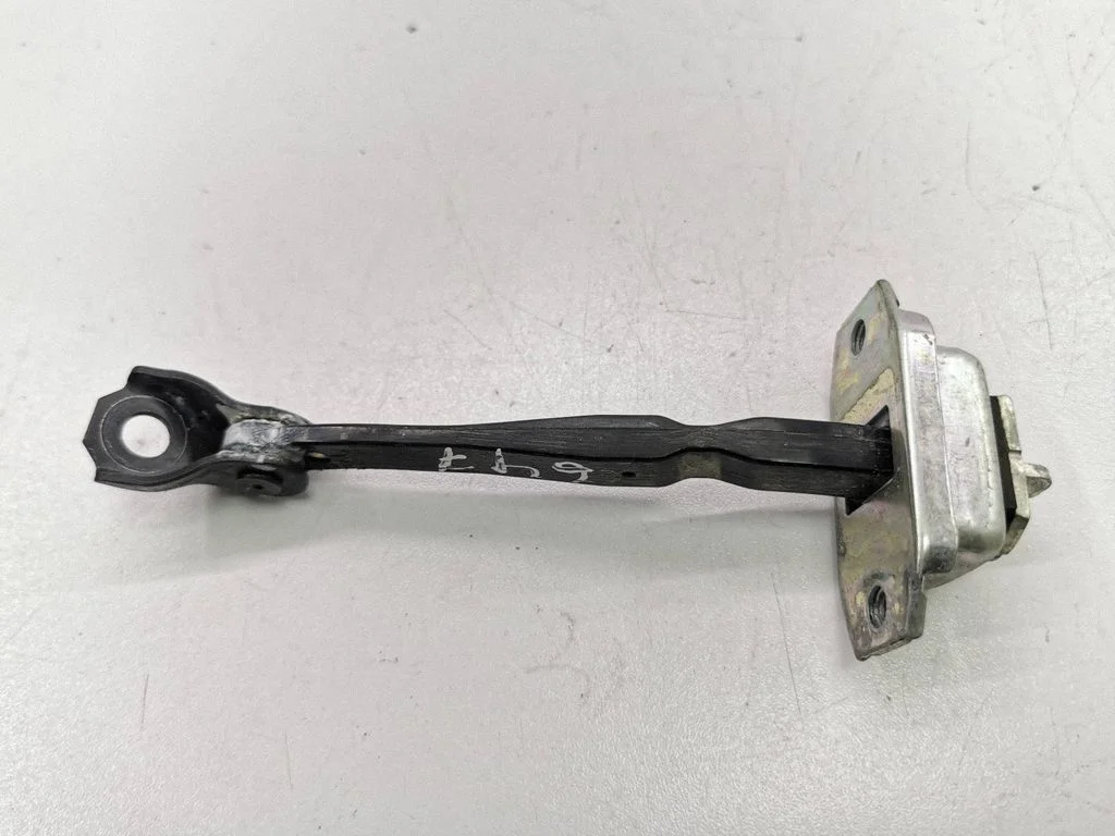 Rear door check strap stopper – left