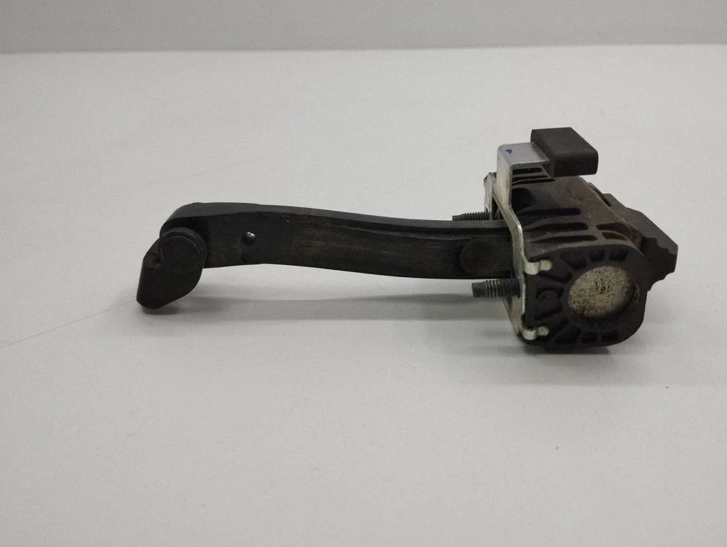 Rear door check strap stopper – right
