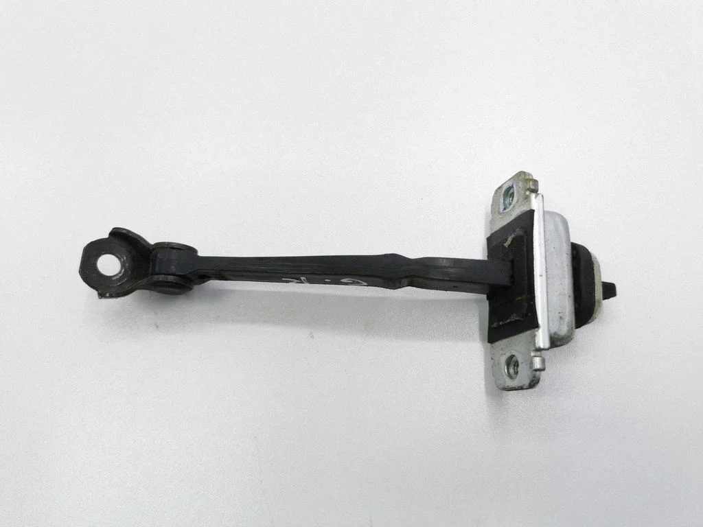 Rear door check strap stopper – left