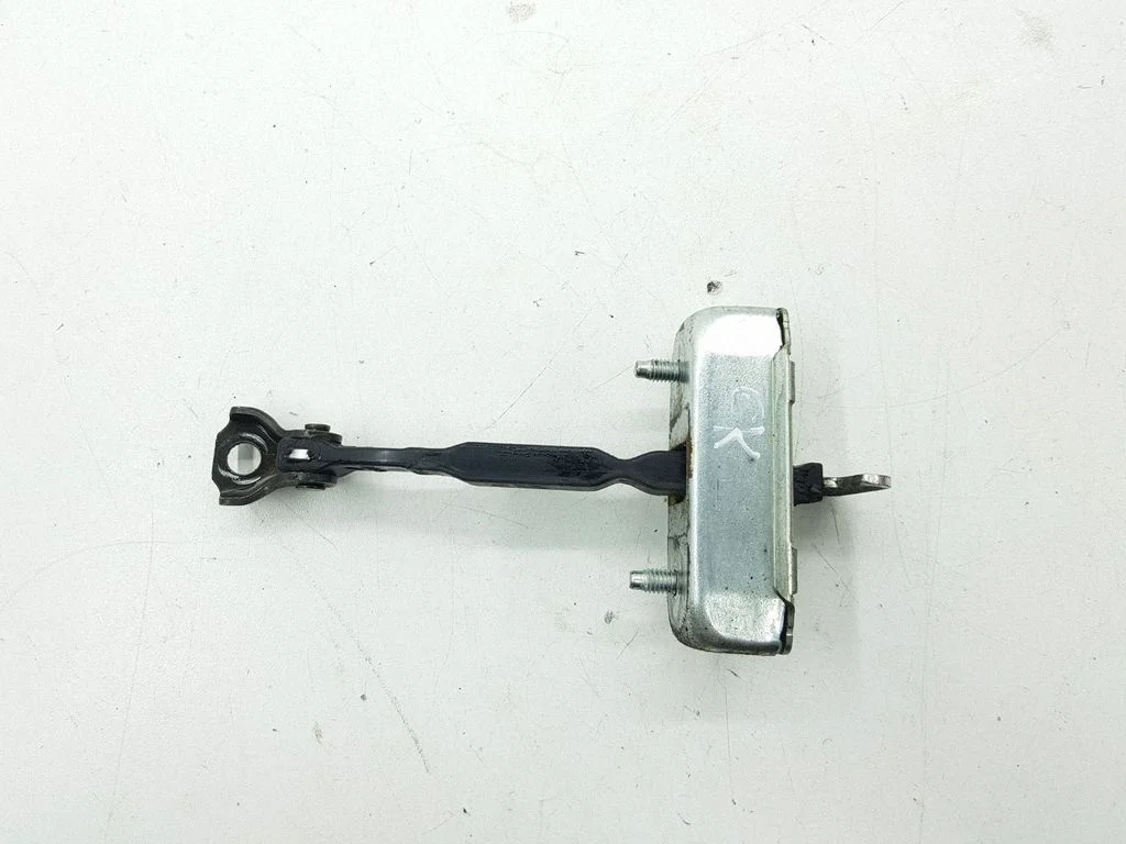 Rear door check strap stopper – left