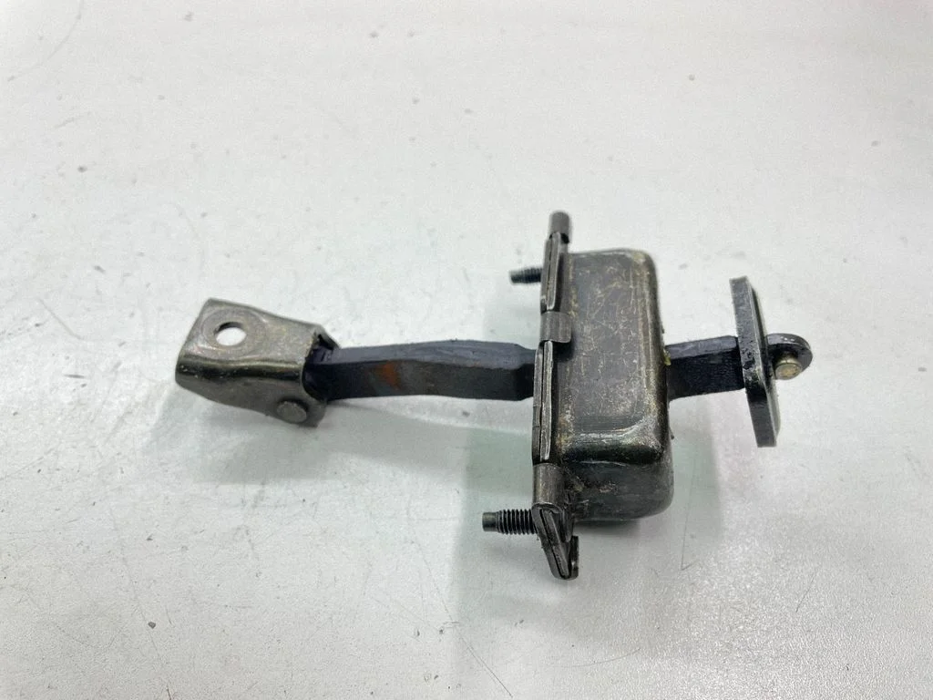 Rear door check strap stopper – right