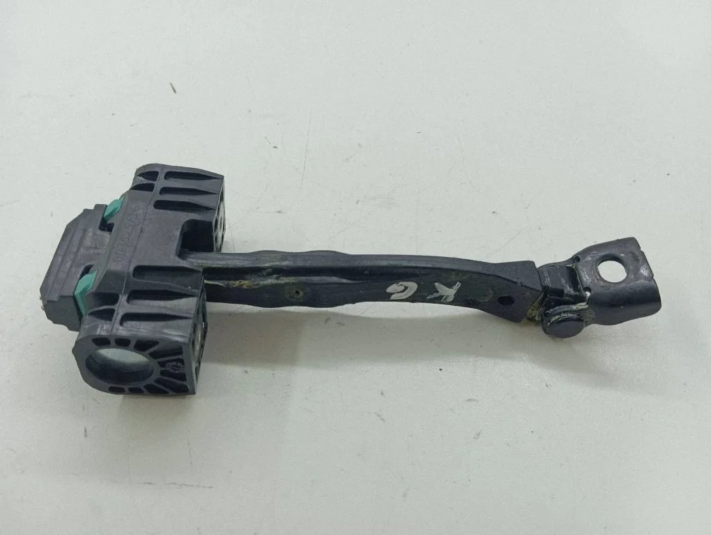 Rear door check strap stopper – left