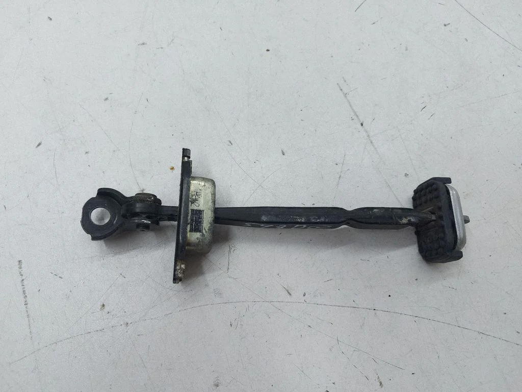 Rear door check strap stopper – right