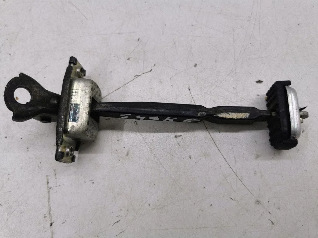 Rear door check strap stopper HBA2