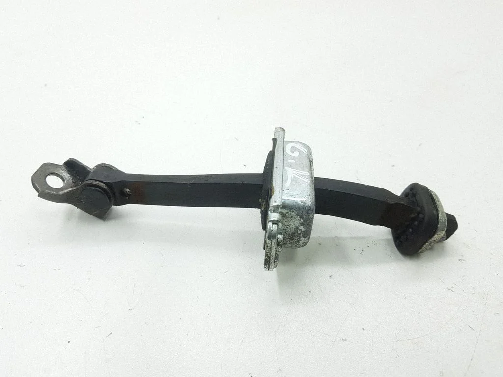 Rear door check strap stopper – rear left