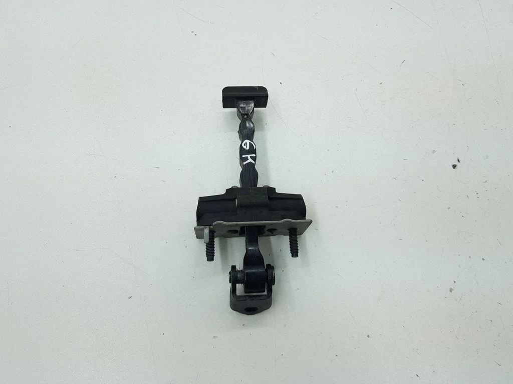 Rear door check strap stopper – left