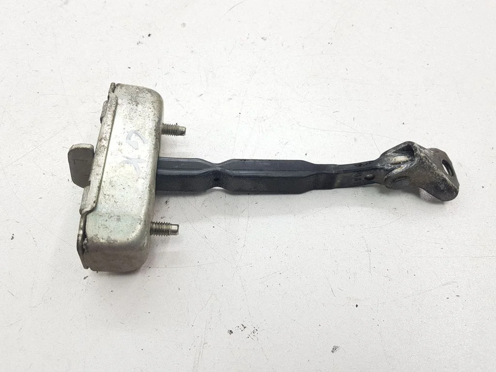 Rear door check strap stopper – left