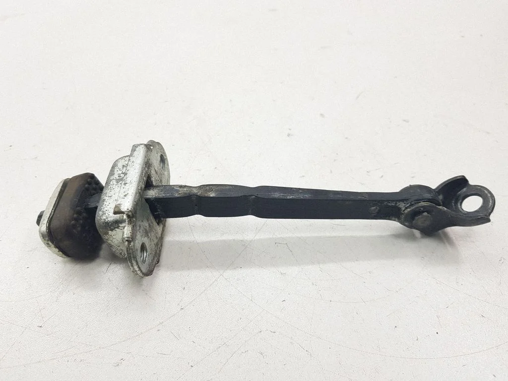 Rear door check strap stopper – left