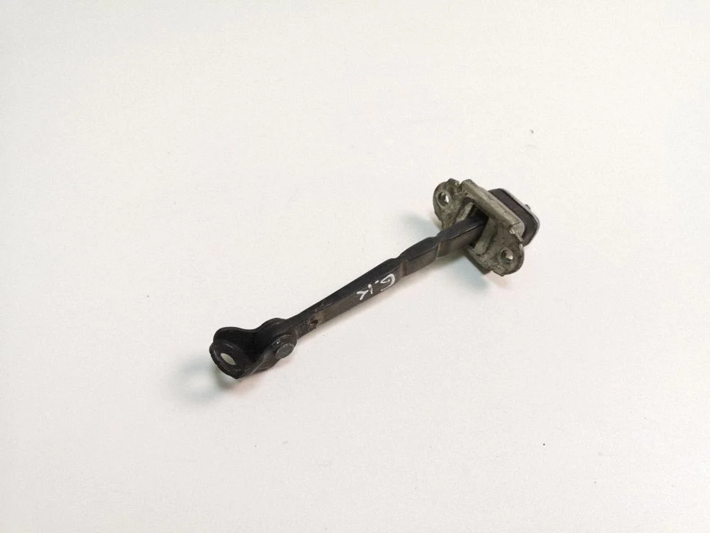 Rear door check strap stopper – left