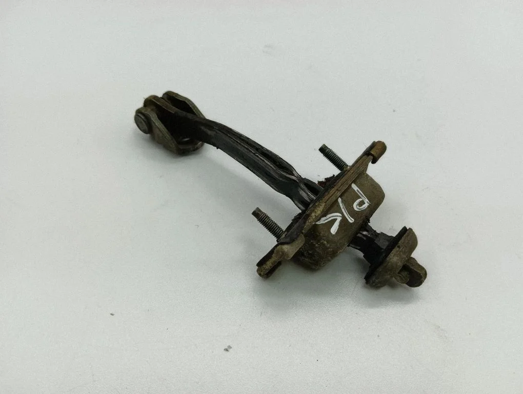Front door check strap stopper – left