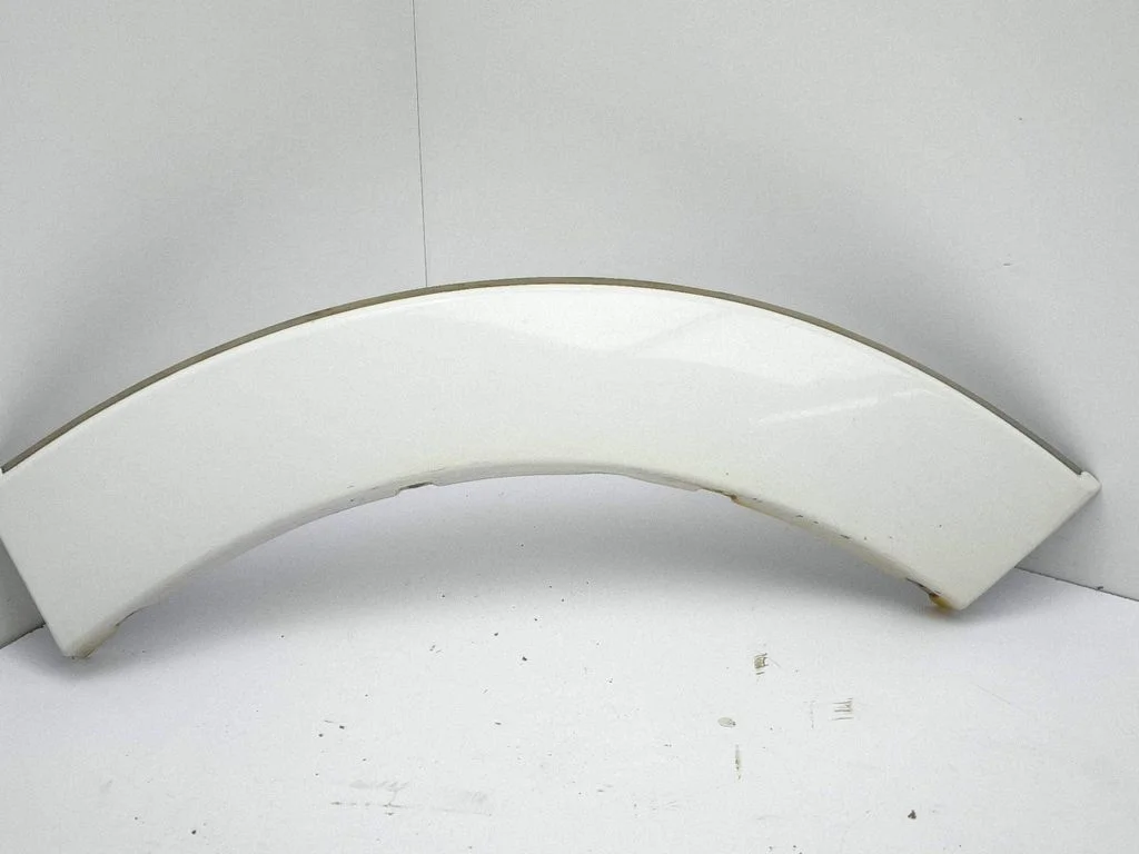 Rear arch trim – left