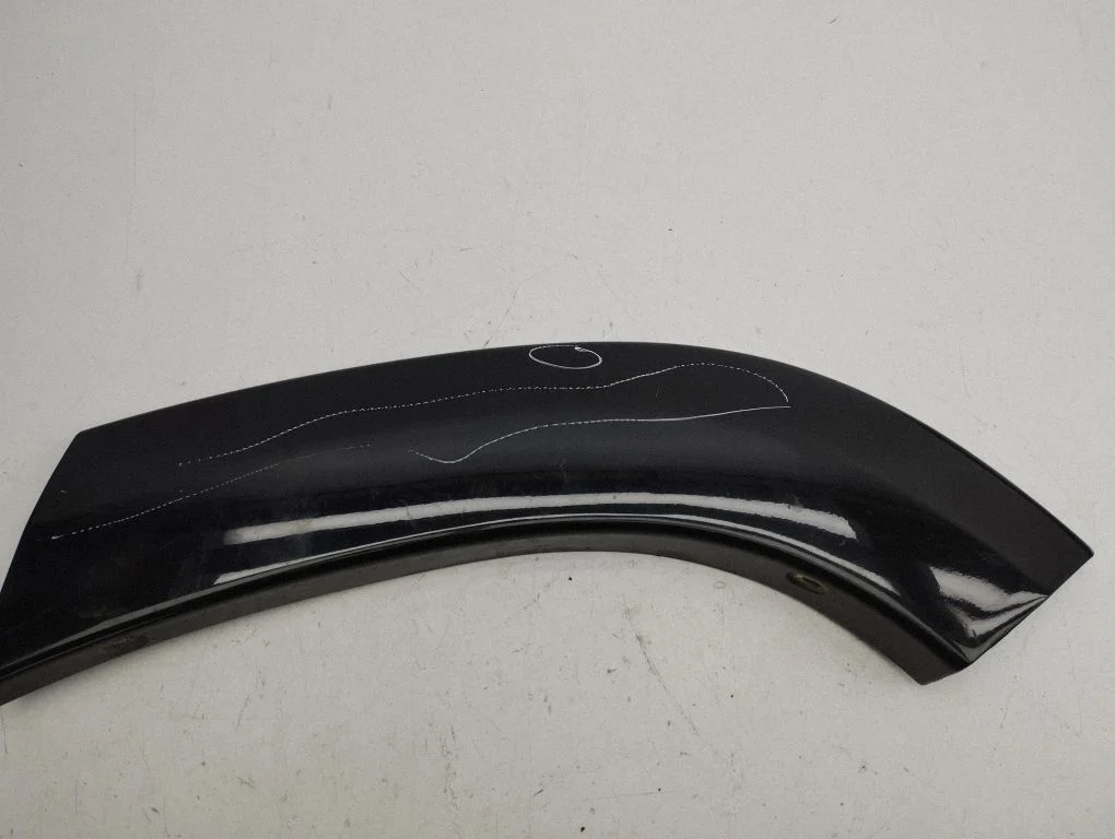 Rear arch trim – left