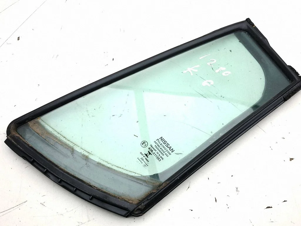 Rear vent window glass – left