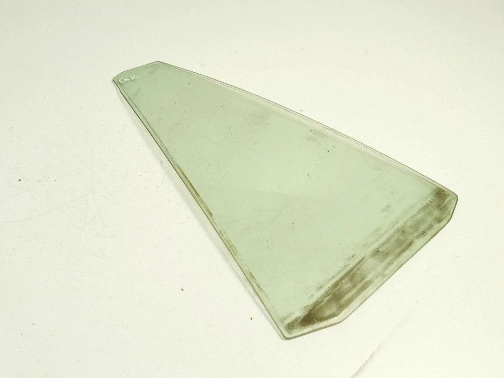 Rear vent window glass – left