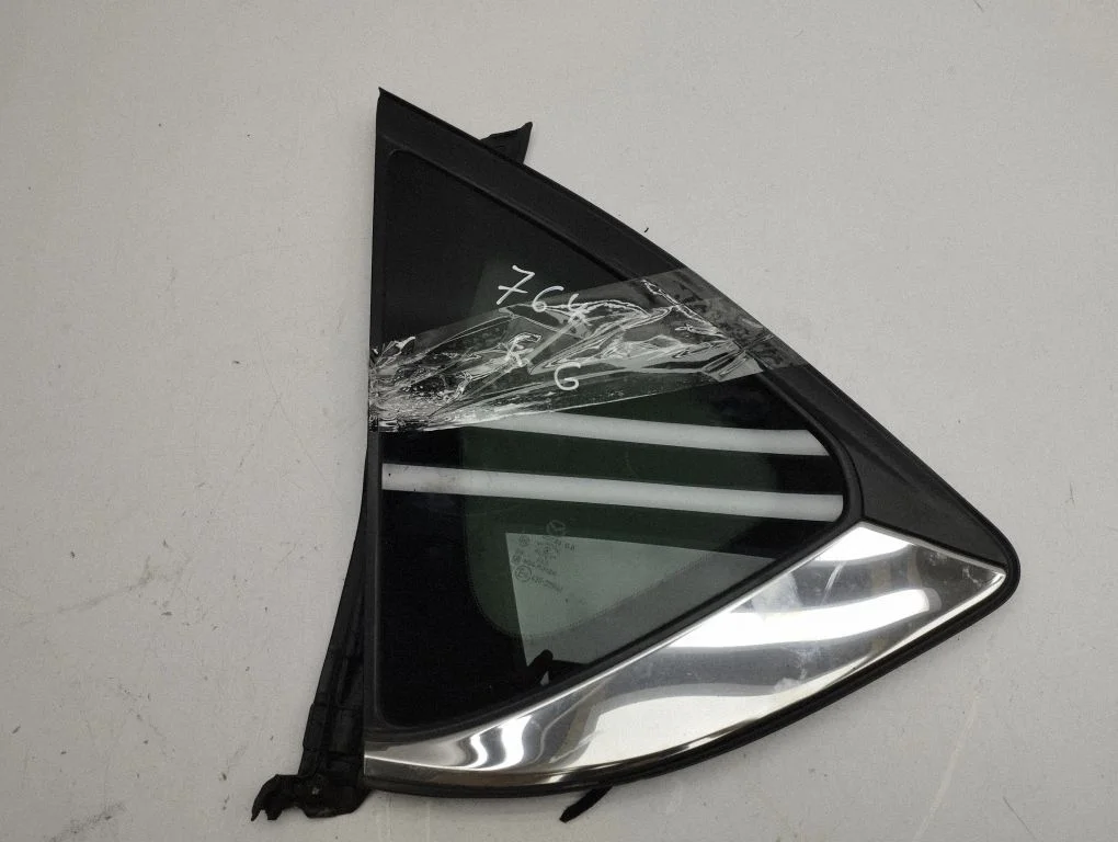 Rear vent window glass – left