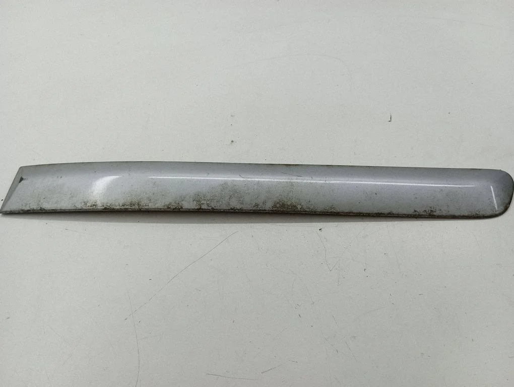 Rear door trim (molding) – left