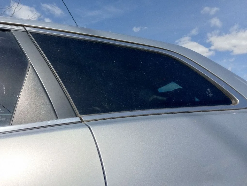 Rear side window – left