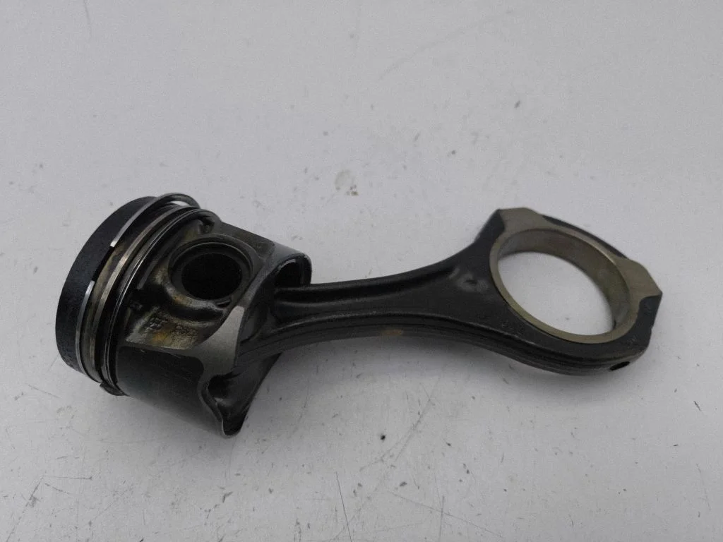 Piston with connecting rod