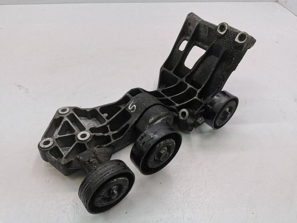 Alternator belt tensioner