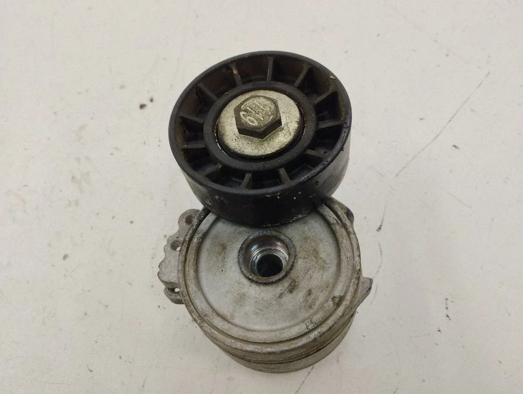 Alternator belt tensioner