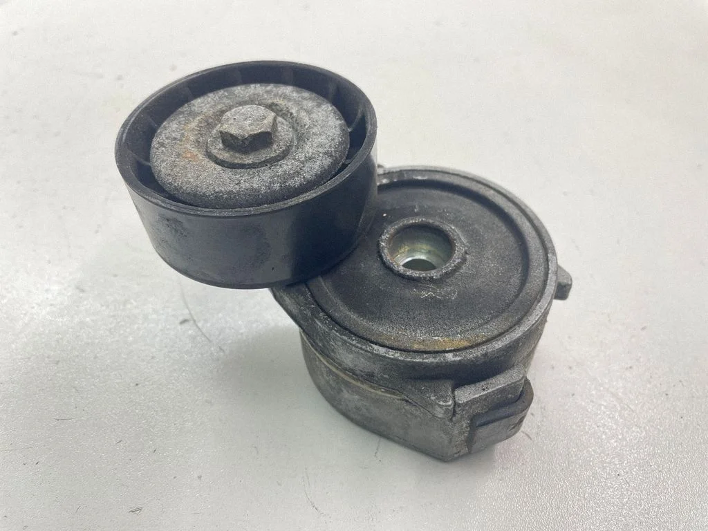 Alternator belt tensioner