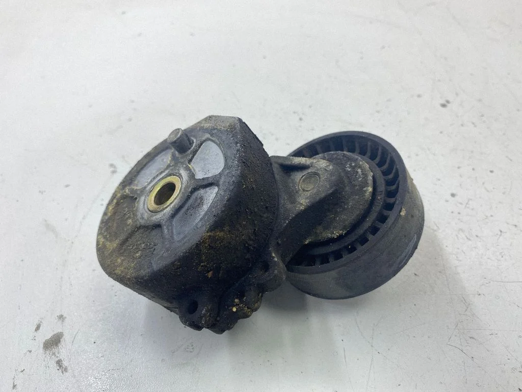 Alternator belt tensioner