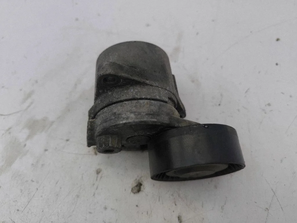 Alternator belt tensioner