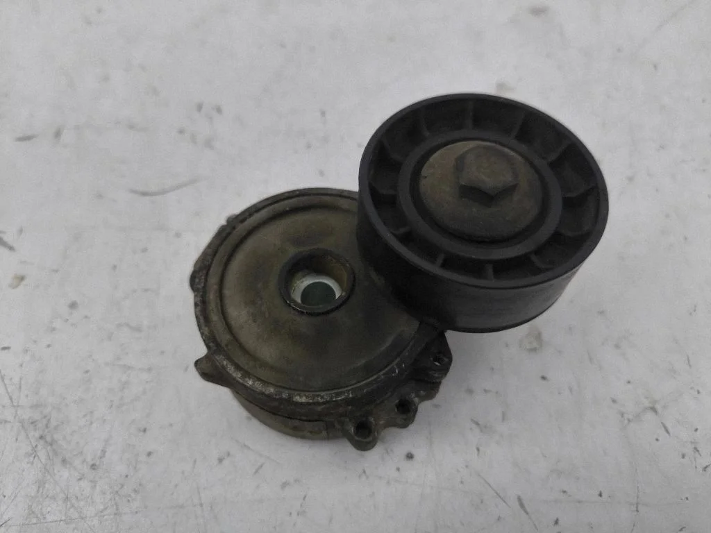 Alternator belt tensioner