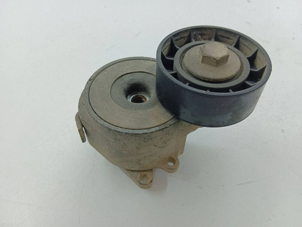 Alternator belt tensioner