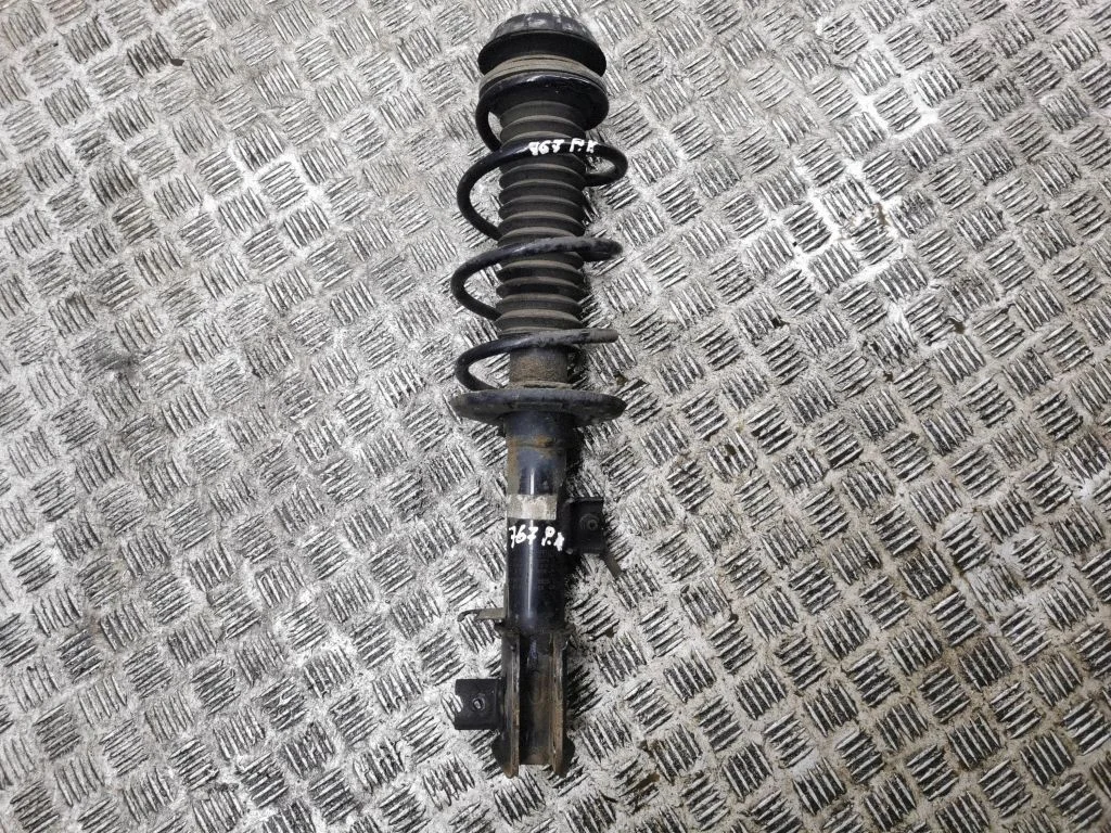 Front shock absorber with coil spring – left