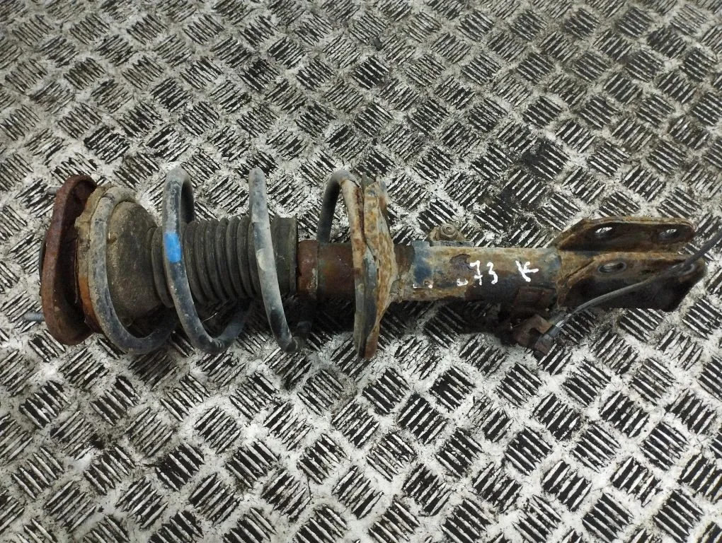 Front shock absorber with coil spring – left