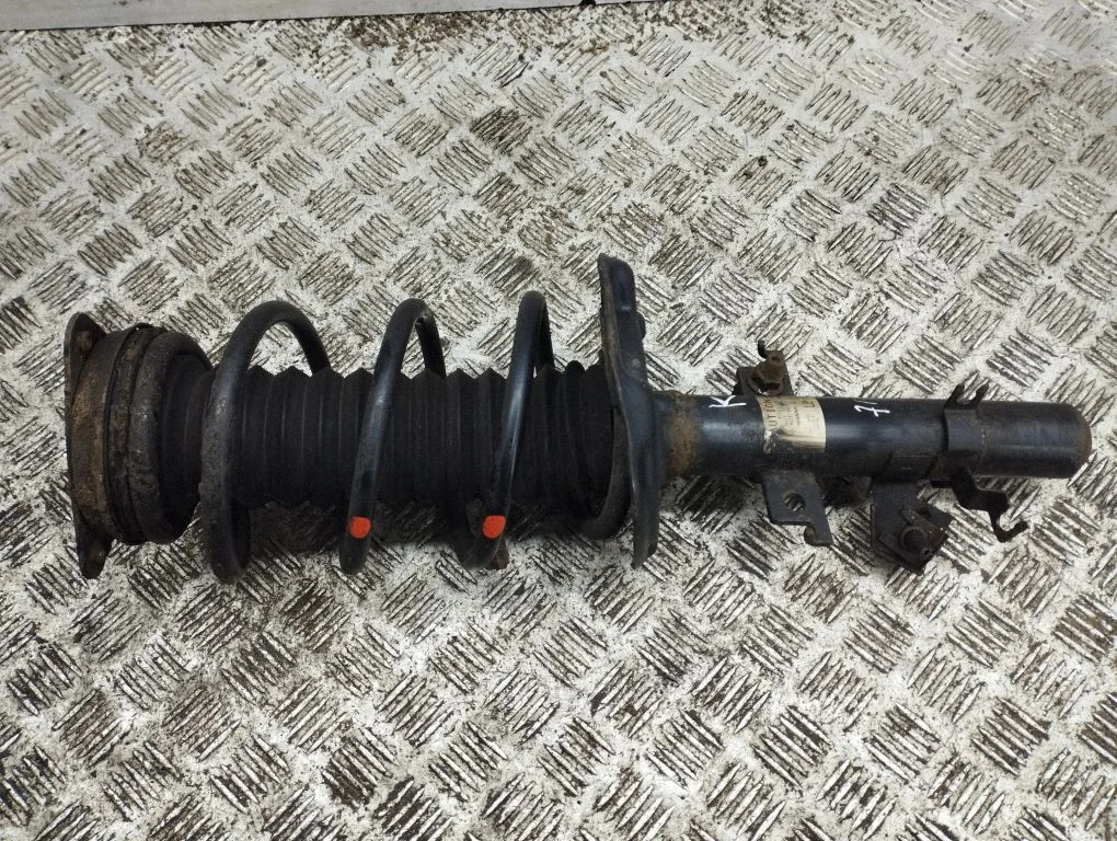 Front shock absorber with coil spring – left
