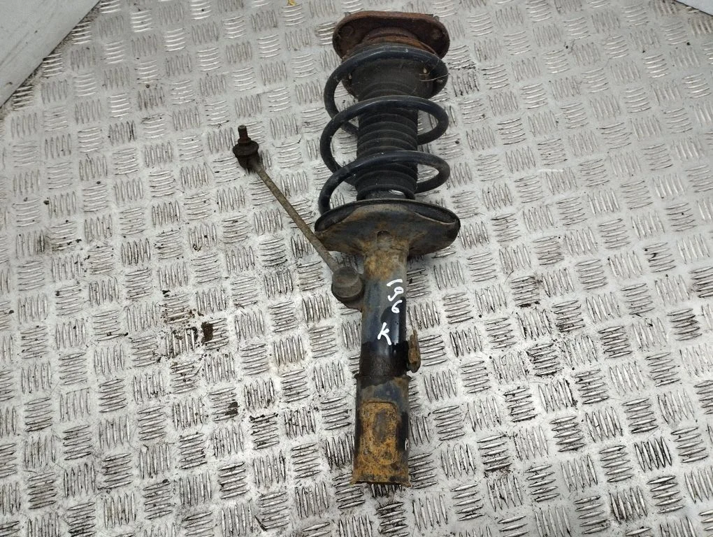 Front shock absorber with coil spring – left