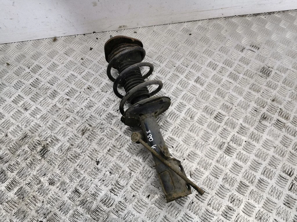 Front shock absorber with coil spring – left