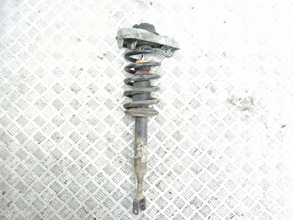 Front shock absorber with coil spring – left