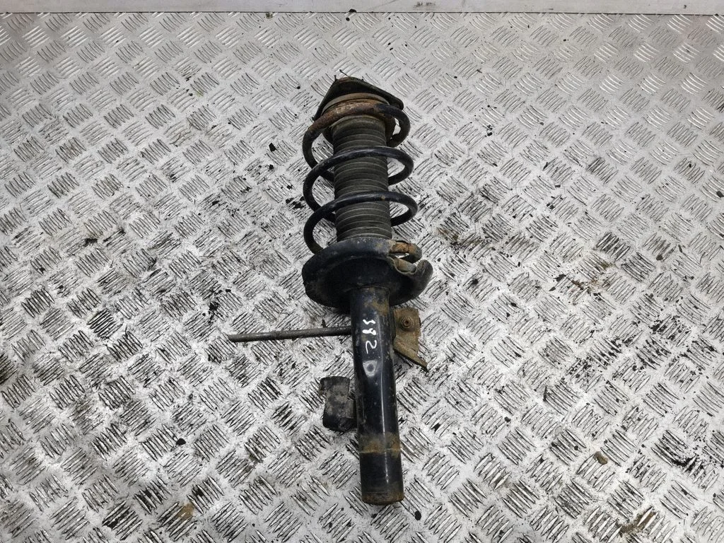 Front shock absorber with coil spring – left