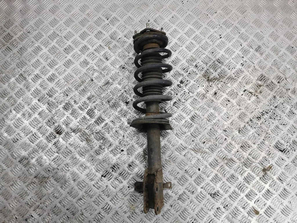 Front shock absorber with coil spring – left