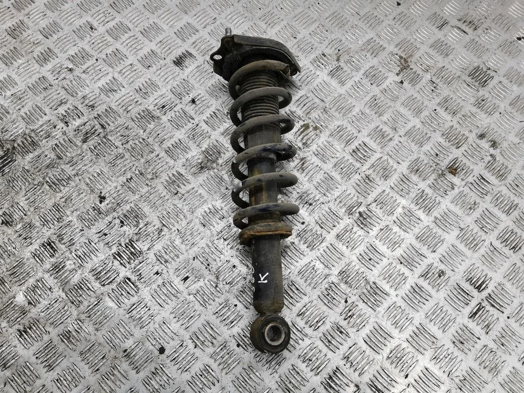 Rear shock absorber with coil spring – left