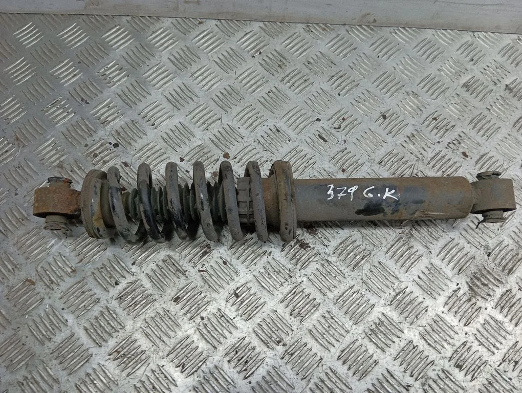 Rear shock absorber with coil spring – left
