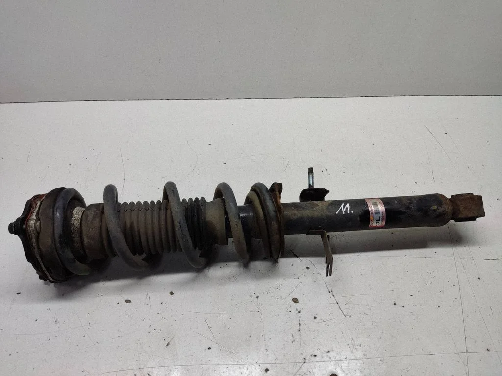 Front shock absorber with coil spring 561111EA0C